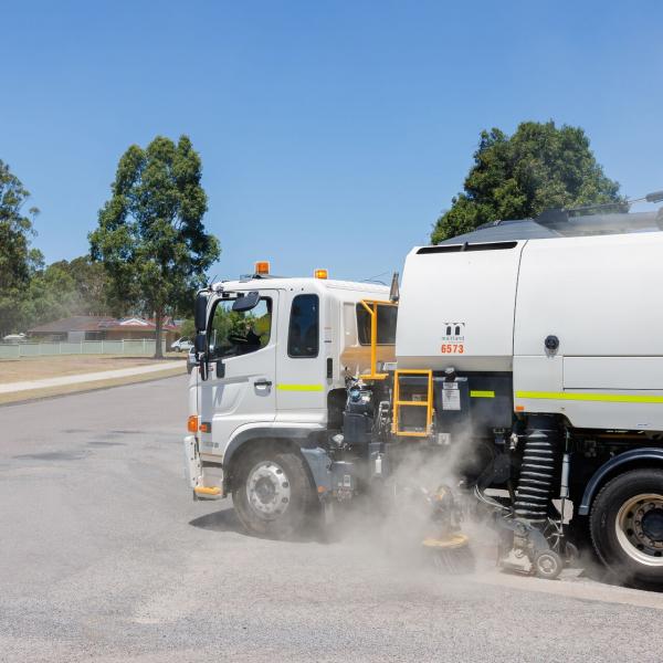 Truck cleaning the street