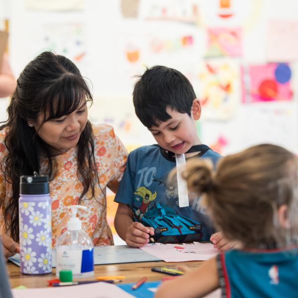 A mother and son participating in Free Art January at Maitland Regional Art Gallery.