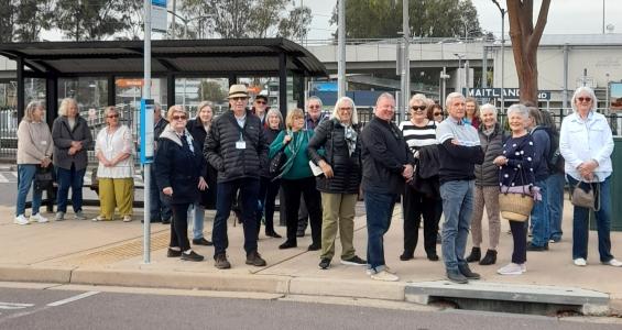 U3A image - group of people standing at a bus stop