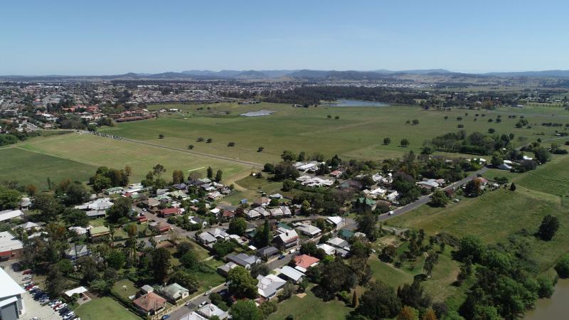 Wide aerial shot of Central Maitland looking out to farm land and housing