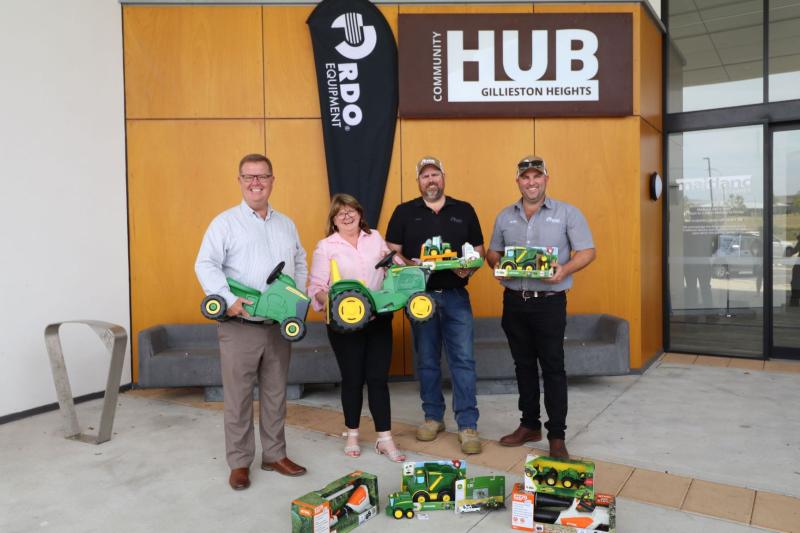 Mayor, Carol Edmonds and John Deere representatives standing out the front of Gillieston Heights Hub