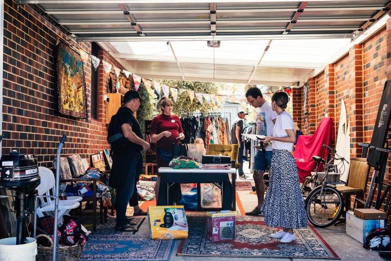 Sellers and shoppers participating in the Garage Sale Trail