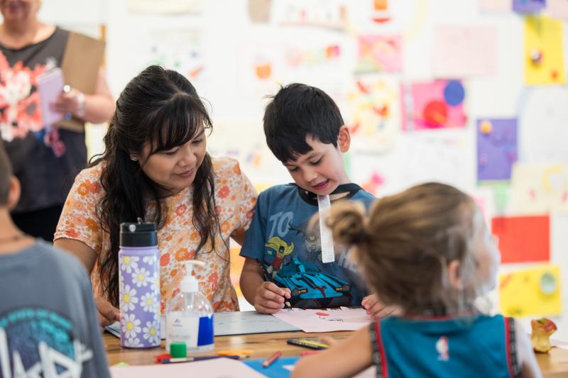 A mother and son participating in Free Art January at Maitland Regional Art Gallery.