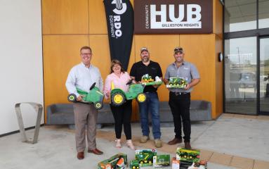 Mayor, Carol Edmonds and John Deere representatives standing out the front of Gillieston Heights Hub