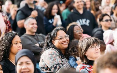 Crowd shot with mother holding child