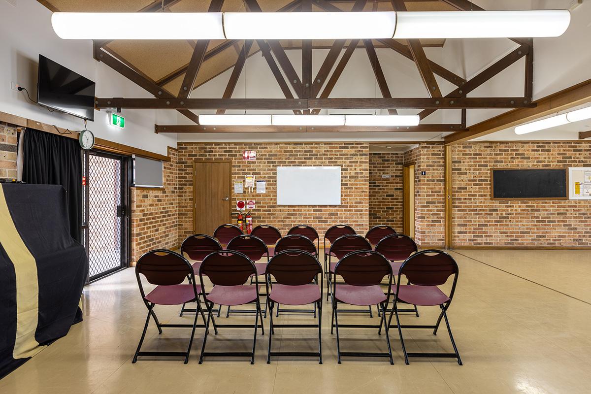 Inside photo of community hall with chairs