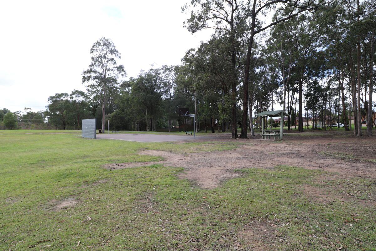 Grass area, playing court and seating