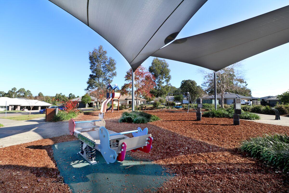 Playground and seesaw under shade sail 