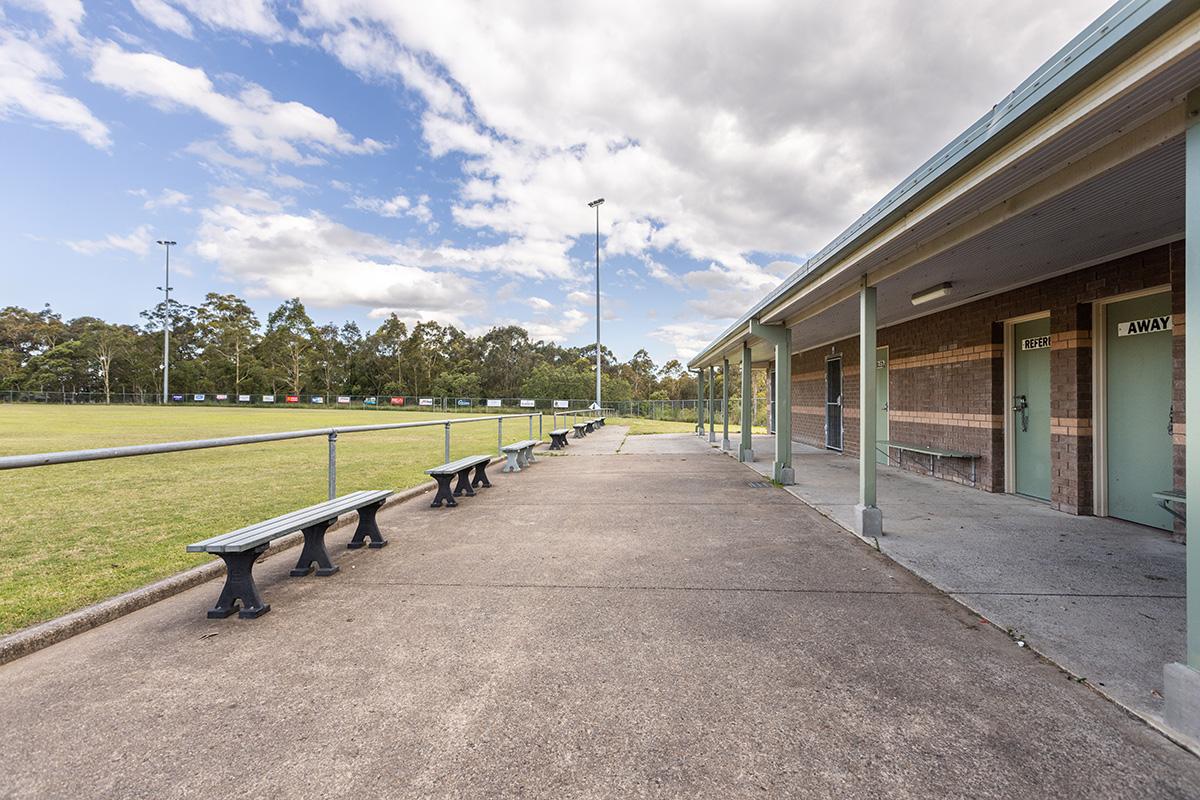 Canteen and amenities building with concrete path and seating 