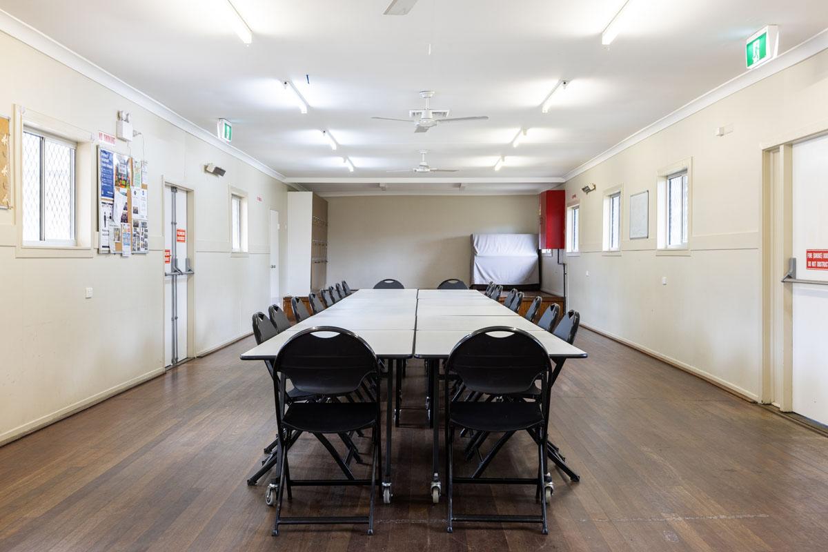 Internal community hall with chairs and table