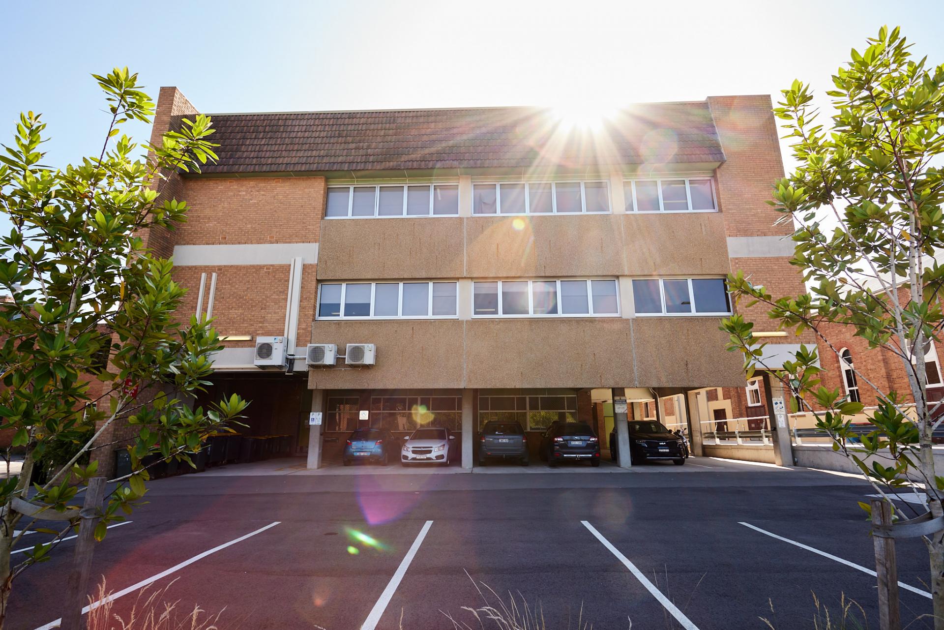 Rear entrance to the building and carparking spaces